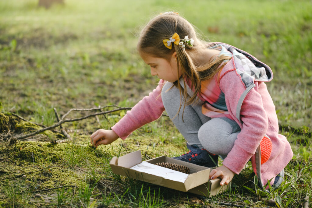 girl on an outdoor nature scavenger hun