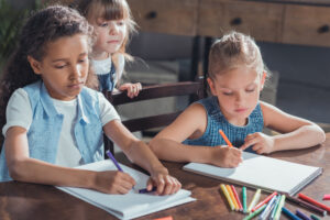 kids writing in school