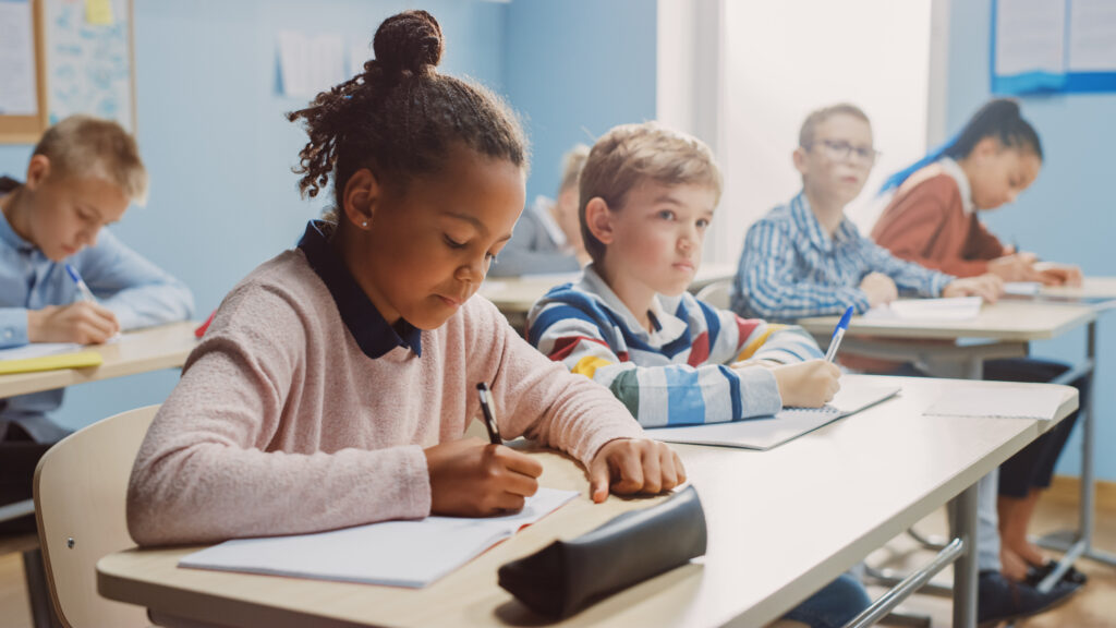 students writing in the classroom